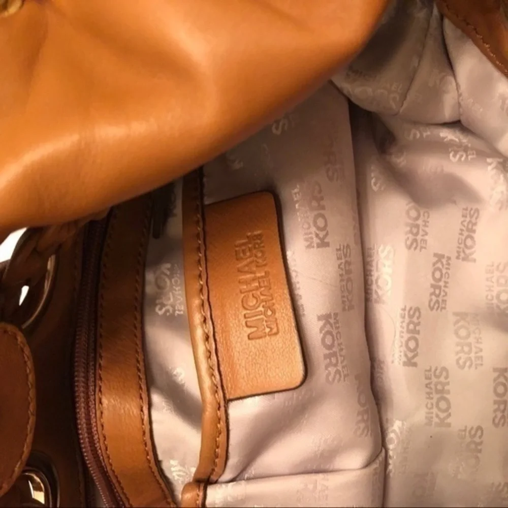 Michael kors brown leather grommet tassel bag